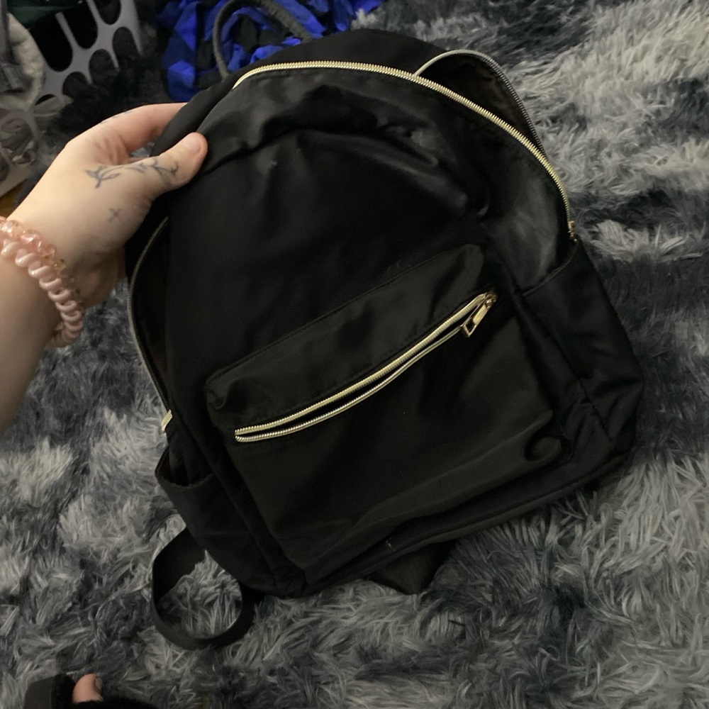 Black Backpack with Gold Zippers